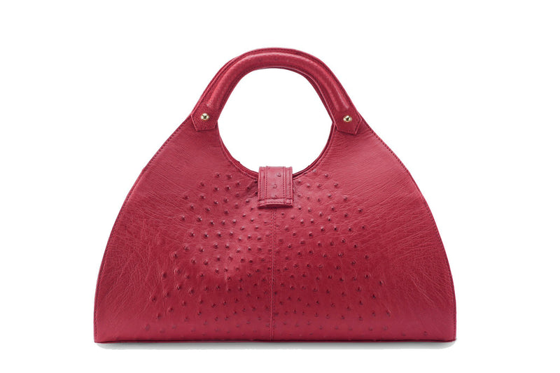 Back view Kimberley red ostrich Leather bag with fold over magnetic strap with D-ring & tassel decoration. Attached round shaped handles decorated with a studs. 