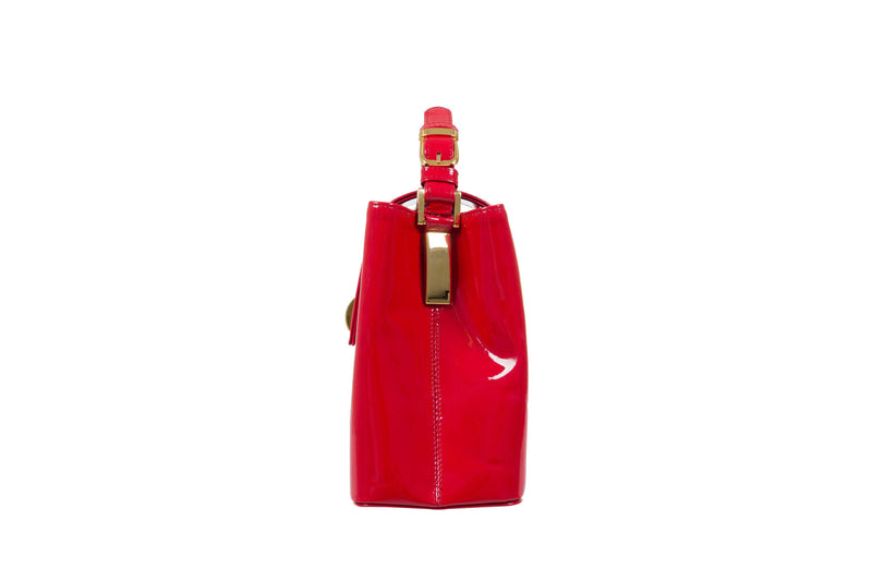 Side view patent leather bag constructed fold over flap with turn lock closure. Adjustable handles decorated with a buckle and gold hardware. Internal zip pocket, two internal patch pockets and a zipper middle pocket. Detachable shoulder strap. High quality red suede leather interior. Bag feet studs.