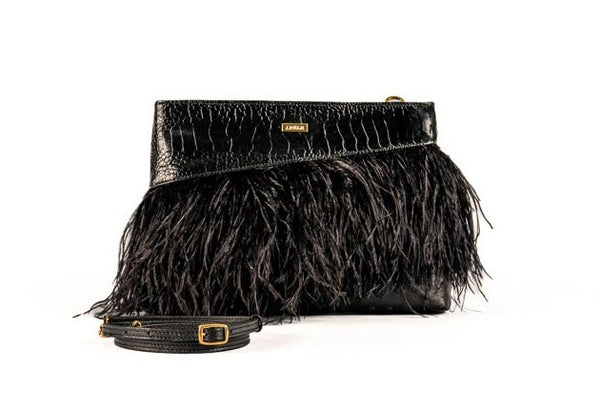 Ostrich body, ostrich shin top insert with ostrich feathers clutch bag with detachable adjustable shoulder strap from the Adele Exclusive Luxury Design Collection. 24 carat gold plated decorative hardware with top zipper and inside back zipper pocket with suede leather lining.