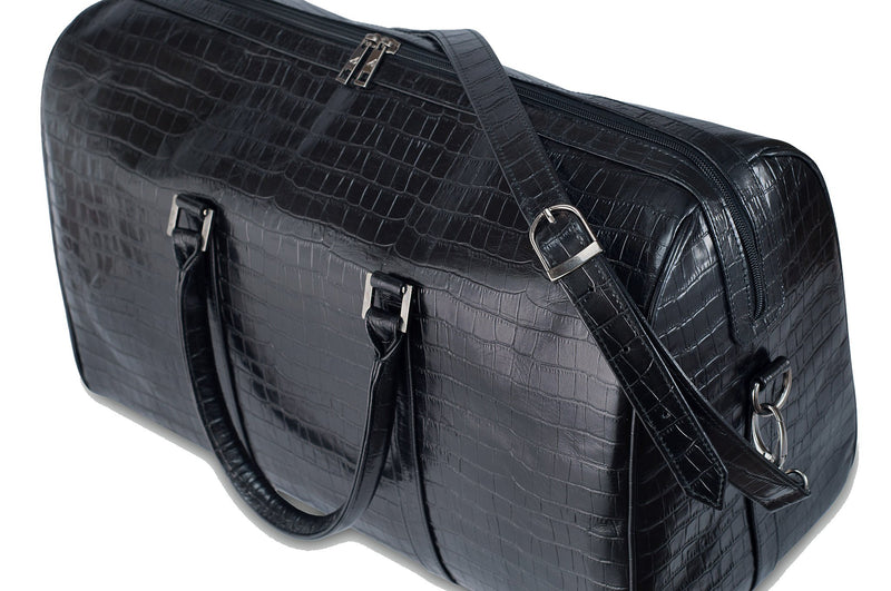 Top side view Chris Embossed Crocodile Leather duffel bag. Double zipper and double carry handle, gun metal hardware. Adjustable detachable shoulder strap. Black suede leather interior, inside zip pocket and two open pockets.