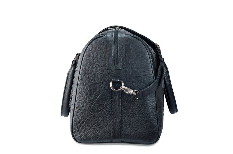 Side view ostrich leather duffel bag crocodile tail insert. Double zipper, double carry handle, gunmetal hardware. Adjustable detachable shoulder strap. Black suede leather interior, inside zip pocket, two open pockets.