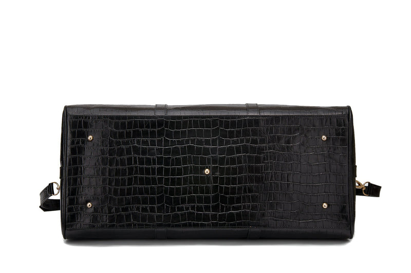 Bottom view embossed Crocodile leather duffel bag. Includes a double zipper and double carry handles. Adjustable and detachable shoulder strap. Black suede leather interior, inside zip pocket and two open pockets. 