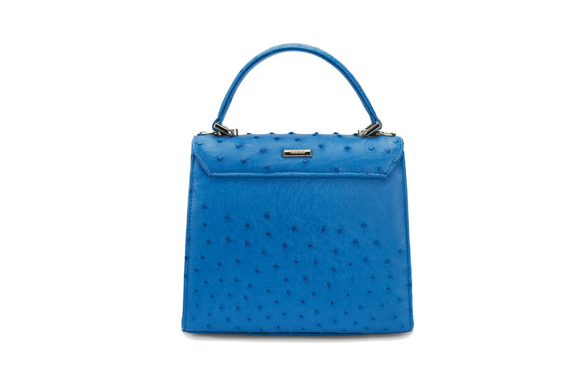 Back  view Ostrich leather constructed top flap handbag with an Italian turn-lock closure. Inside zipper pocket, leather suede interior. Top handle 24 carat gold plated hardware,detachable shoulder strap with adjustable buckle. Bottom feet studs.