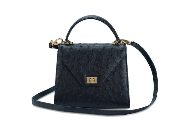 Front view with shoulder strap. Ostrich leather constructed top flap handbag with an Italian turn-lock closure. Inside zipper pocket, leather suede interior. Top handle 24 carat gold plated hardware,detachable shoulder strap with adjustable buckle. Bottom feet studs.