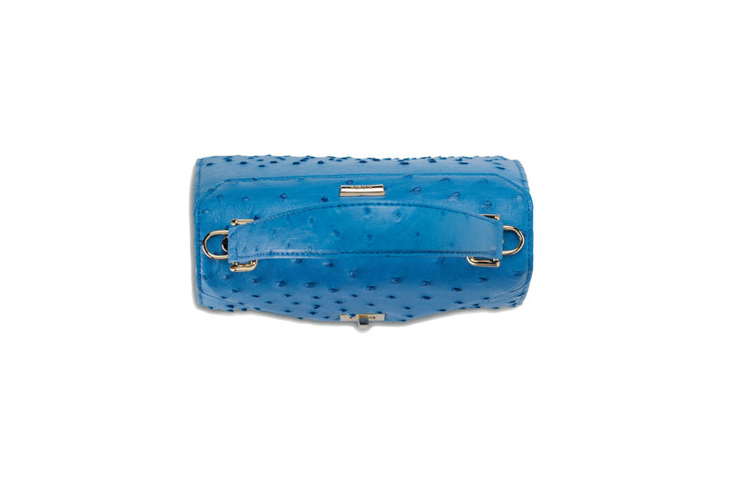 Top view Ostrich leather constructed top flap handbag with an Italian turn-lock closure. Inside zipper pocket, leather suede interior. Top handle 24 carat gold plated hardware,detachable shoulder strap with adjustable buckle. Bottom feet studs.