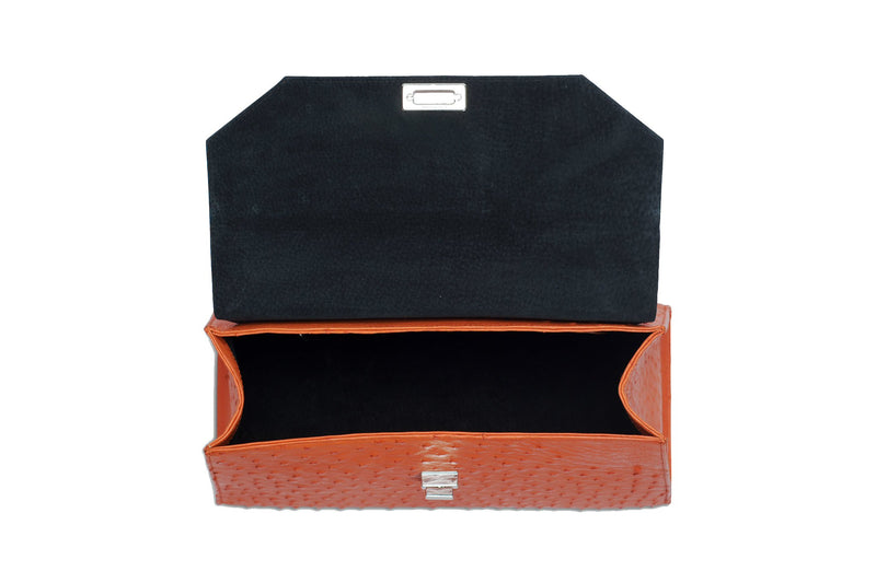 Open top view ostrich leather constructed top flap handbag turn lock. Top handle, adjustable detachable shoulder strap with snap hooks. High quality black leather interior. Inside zip pocket with internal patch pocket. High quality suede leather lining. Bottom bag feet studs.