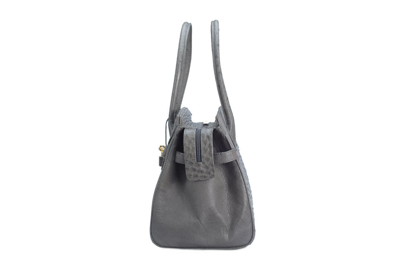 Ostrich leather bag with top zip. The interior contains an inside zip pocket with two internal patch pockets, and is lined with high quality black suede leather. Features a double handle and a gold lock system as decorative hardware. Bag feet studs are located on the bottom panel of the bag.