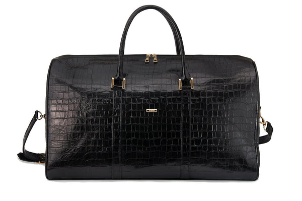 Front view embossed Crocodile leather duffel bag. Includes a double zipper and double carry handles. Adjustable and detachable shoulder strap. Black suede leather interior, inside zip pocket and two open pockets.