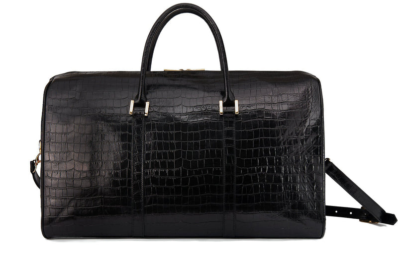 Back view embossed Crocodile leather duffel bag. Includes a double zipper and double carry handles. Adjustable and detachable shoulder strap. Black suede leather interior, inside zip pocket and two open pockets.